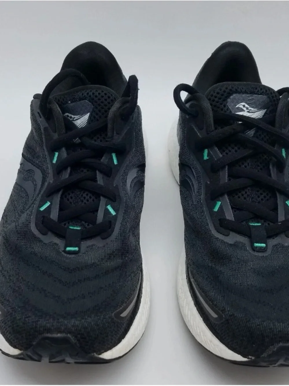 Saucony Black Running Shoes with Teal Accents